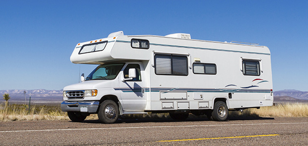 RV on the side of a highway on a sunny day