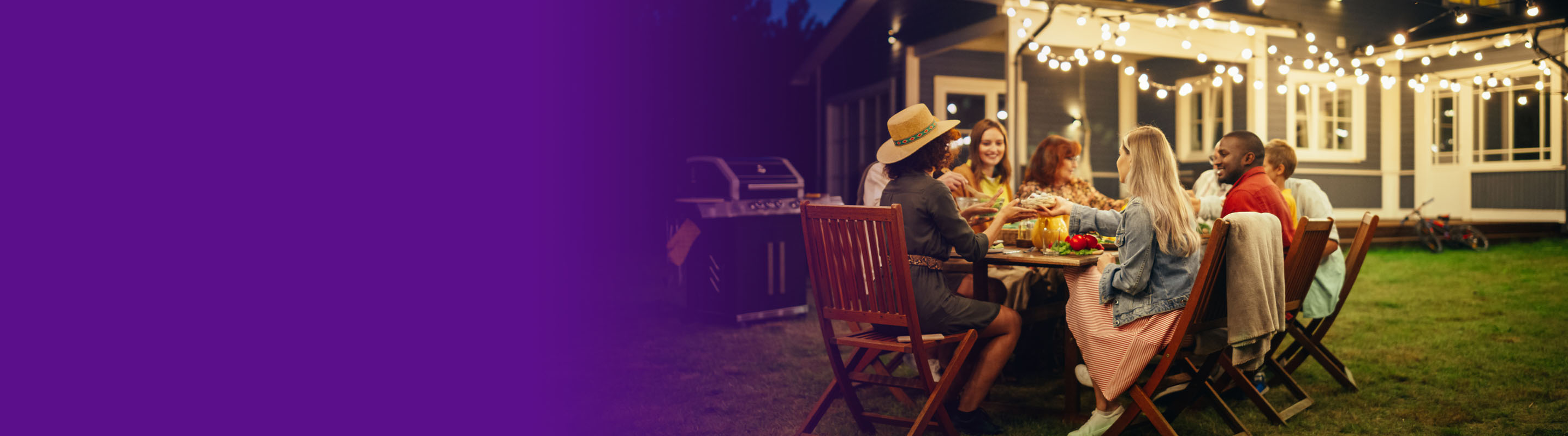 group of friends having dinner in the backyard