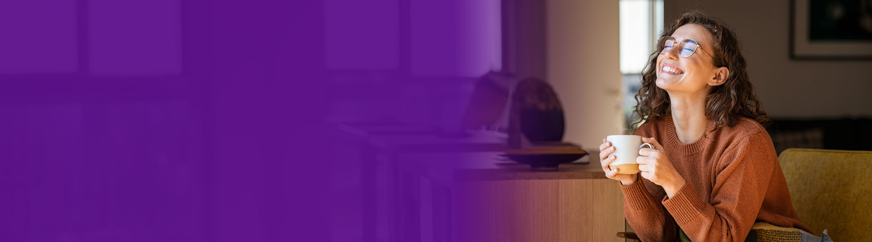 young women smiling drinking coffee