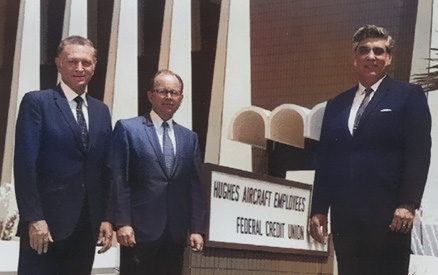 Hughes aircraft employees standing in front of building