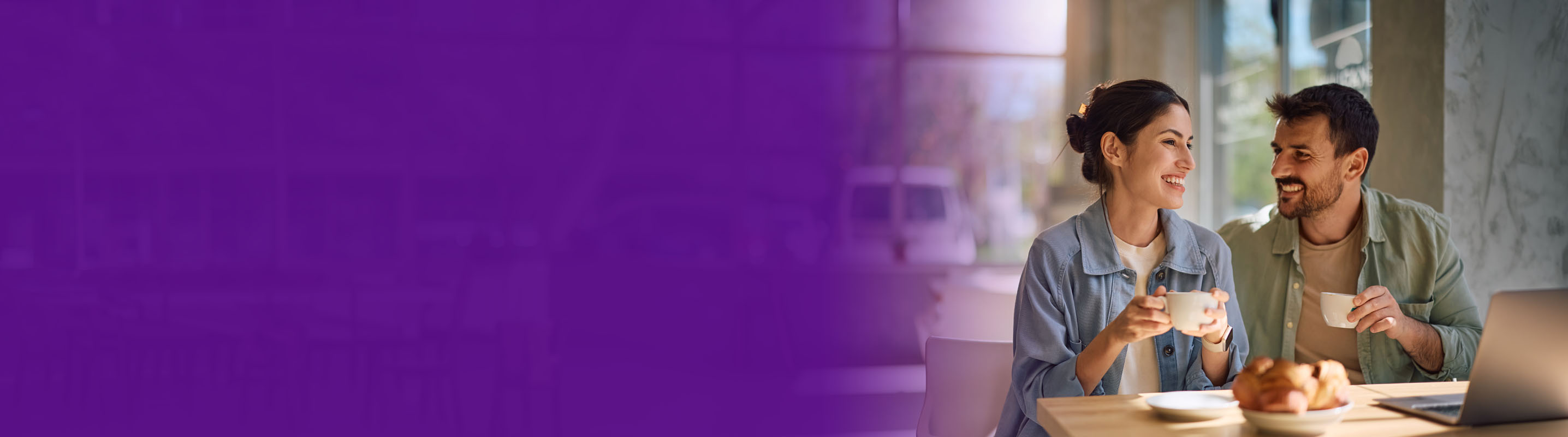 couple standing sipping on coffee