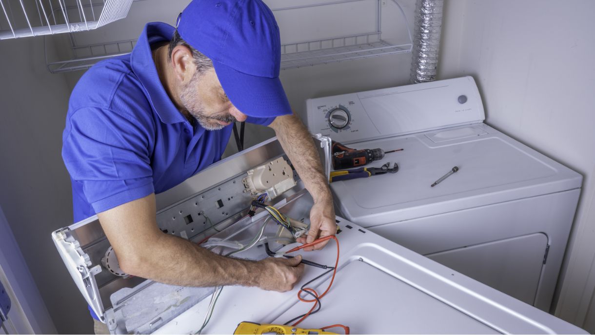 handy man fixing an appliance