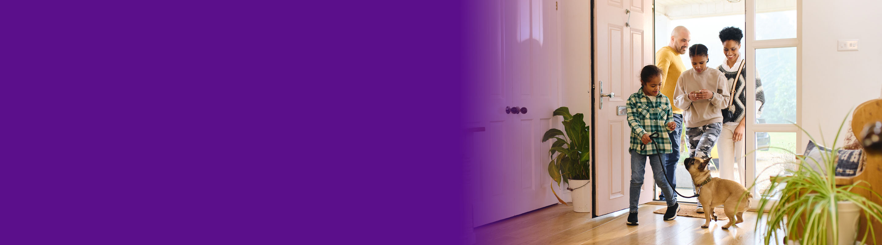 image of a family walking into their home