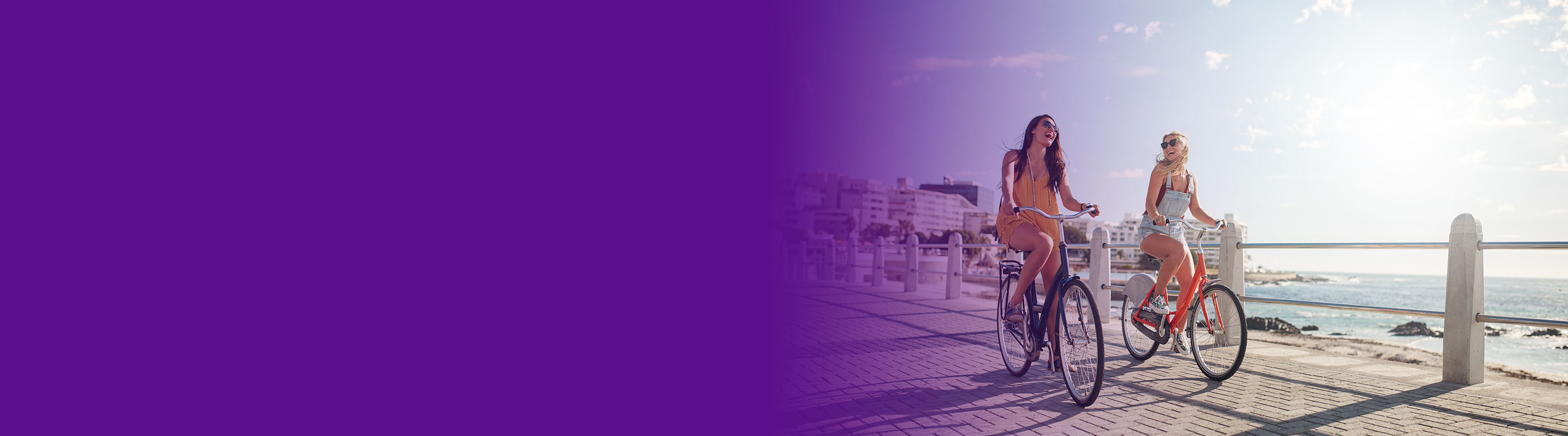 image of women riding bicycles on the beach
