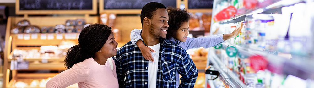 A family shops for groceries together.