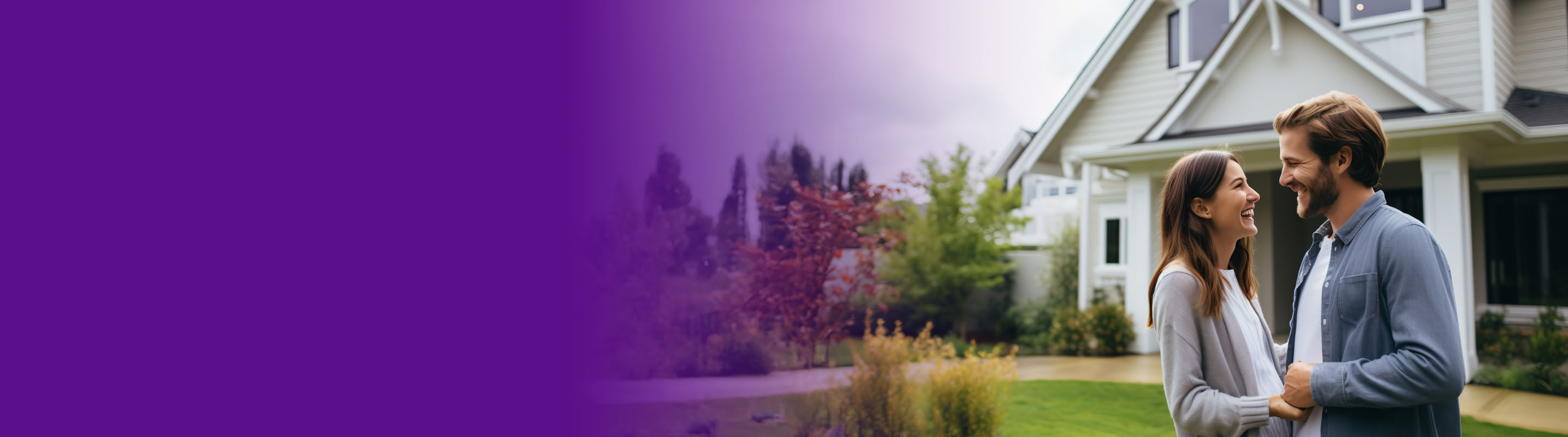 couple in front of their new home