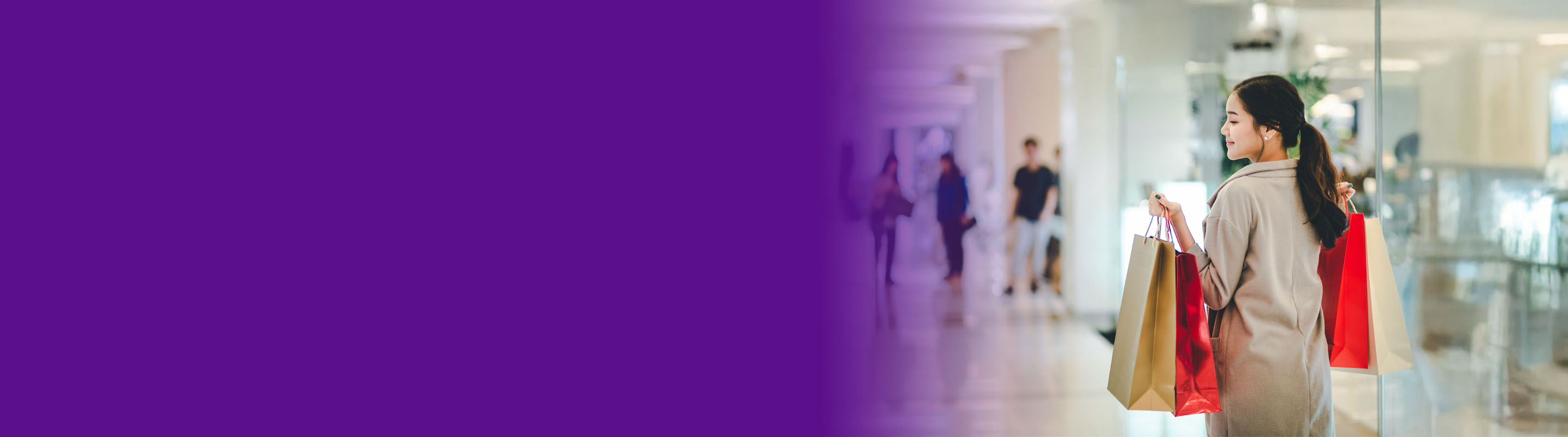 Young women shopping carrying bags