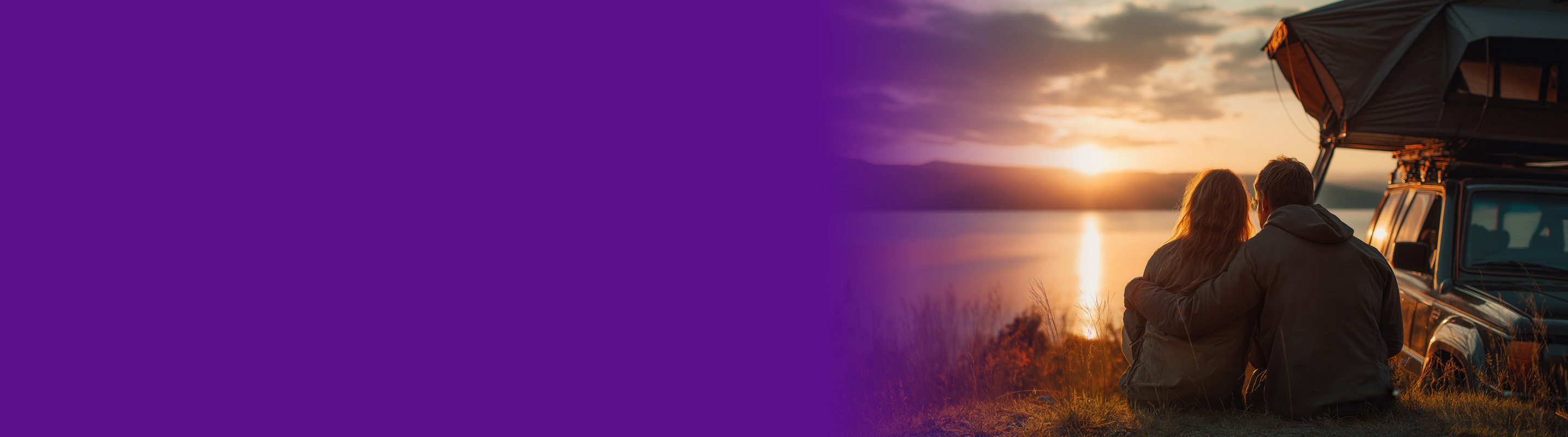 couple hugging looking at the sunset